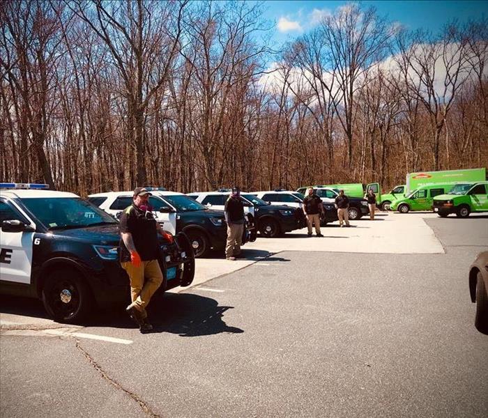 SERVPRO Crew and vehicles standing by First Responder Vehicles